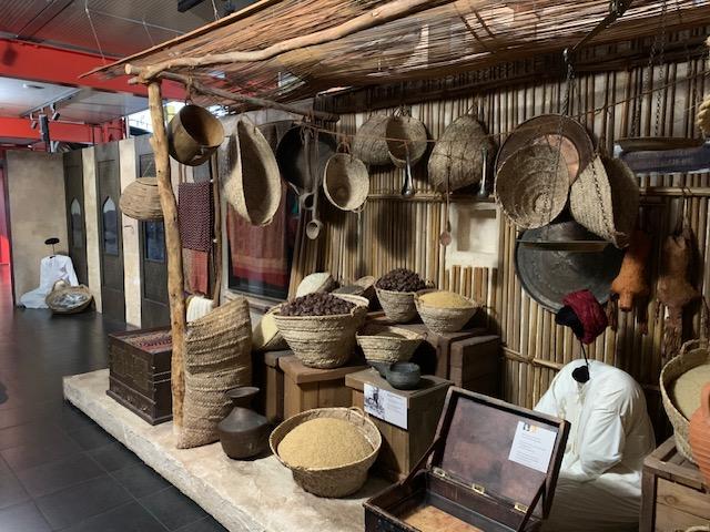 A display of baskets and crates of produce made to resemble a Middle Eastern bazaar.