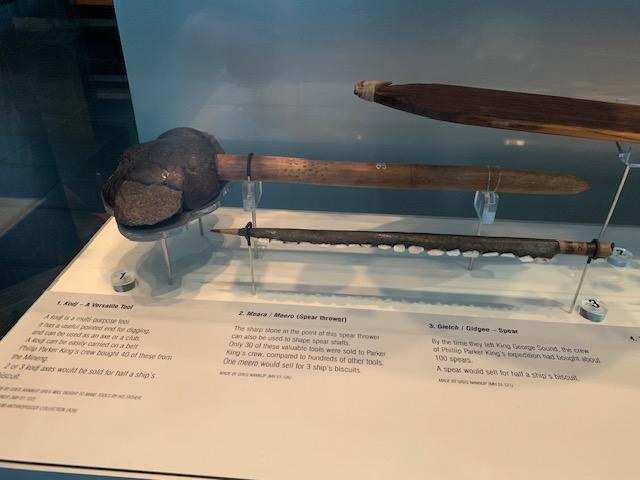 Alt text: a display of Aboriginal artefacts, including meara/meero (spear thrower), kodj (axe/club), and Gietch/Gidgee (Spear).