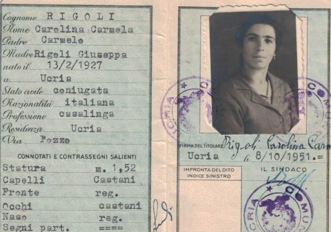 typed text on a blue background, featuring a black and white head shot of a woman with dark hair. There are round purple stamps covering the photo and some text