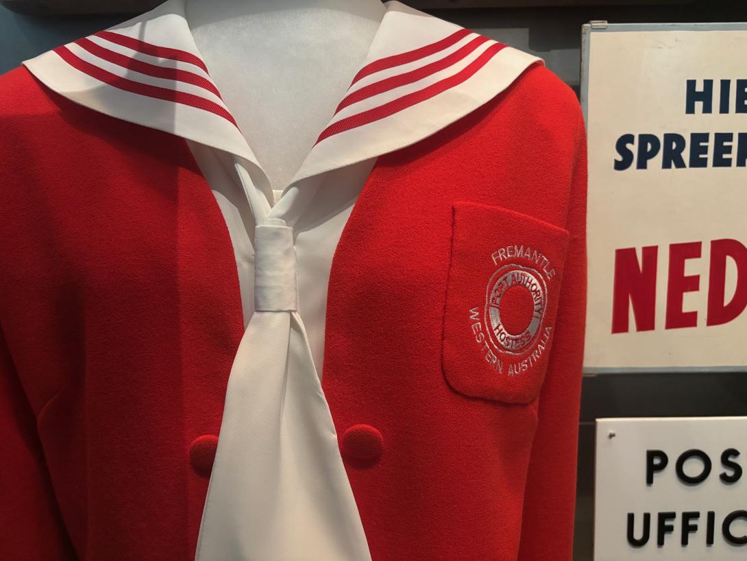 A red jacket in a sailor suit design, featuring a shite collar with red stripes