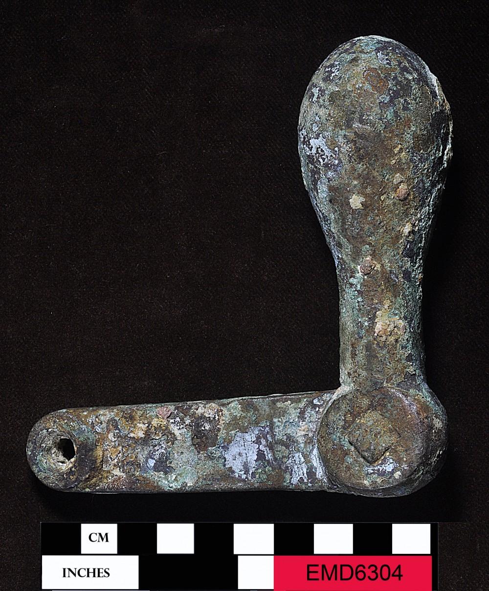 A heavily corroded metal piece of machinery, photographed in the Museum's collections.