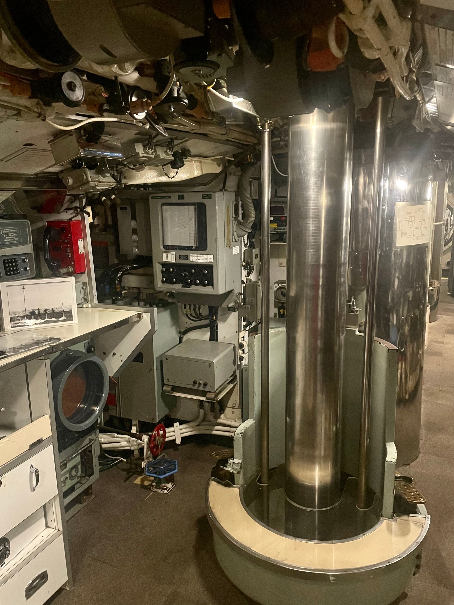 The submarine's periscope has been stowed away, so its thick metal piston is in its place.