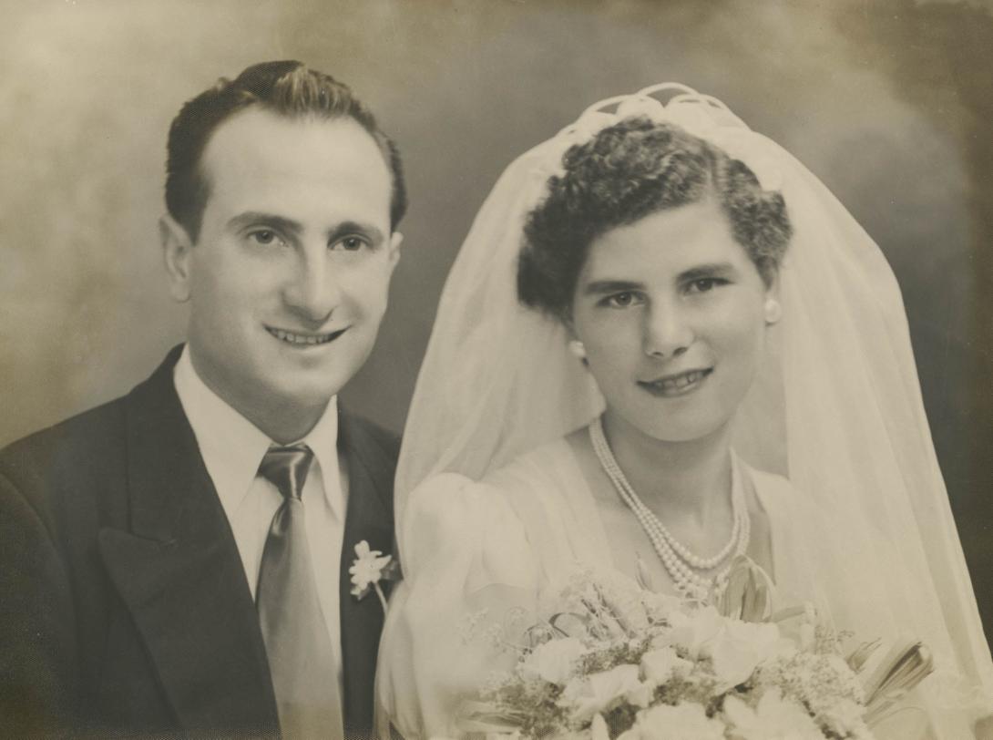 Professional studio portrait of the couple in wedding dress and suit..