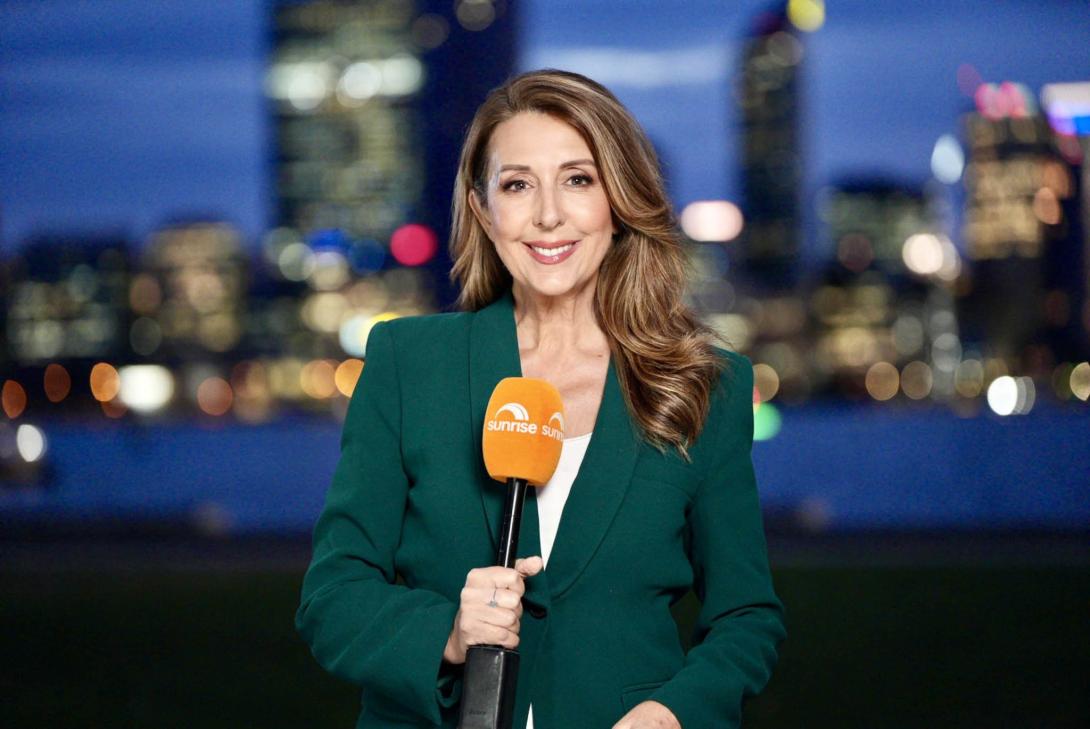 Tina holding a "Sunrise" branded microphone with a backdrop showing Perth city at night.