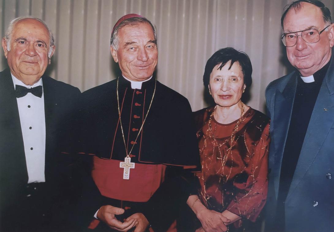 Frances and John with two priests.