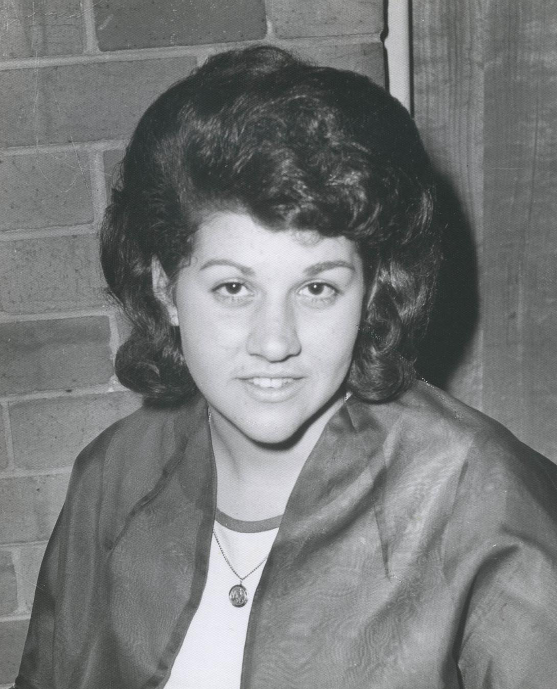Black and white photo of Louisa as a young woman.