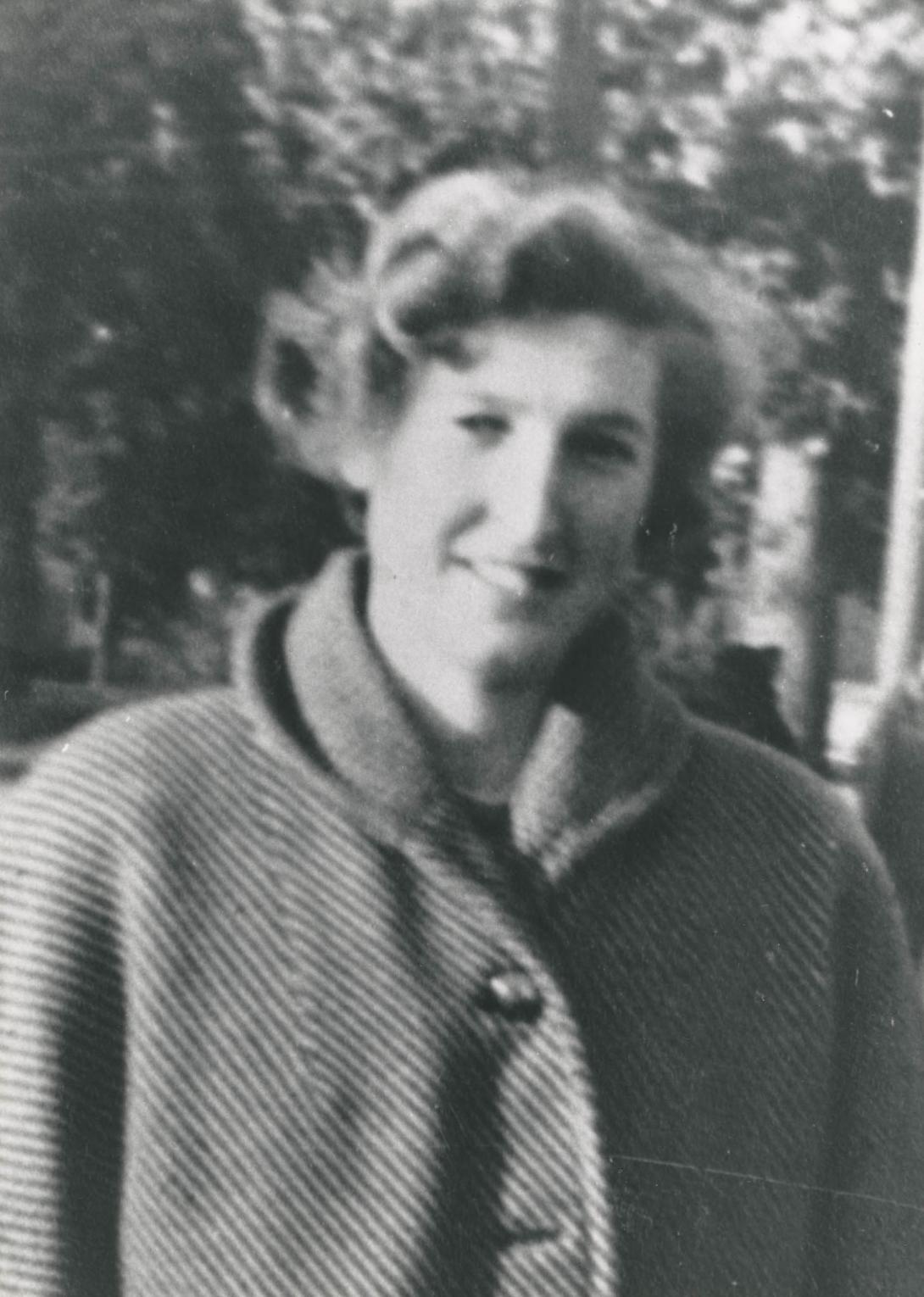 Maria as a young woman in a blurry candid black & white photo.
