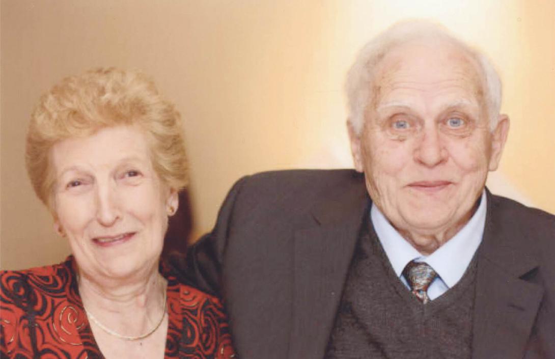 Close-up portrait of the couple side by side.