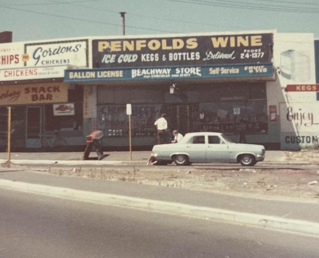 The shop's sign reads "Beachway Store," advertising Penfolds wine, ice cold kegs & bottles - delivered!