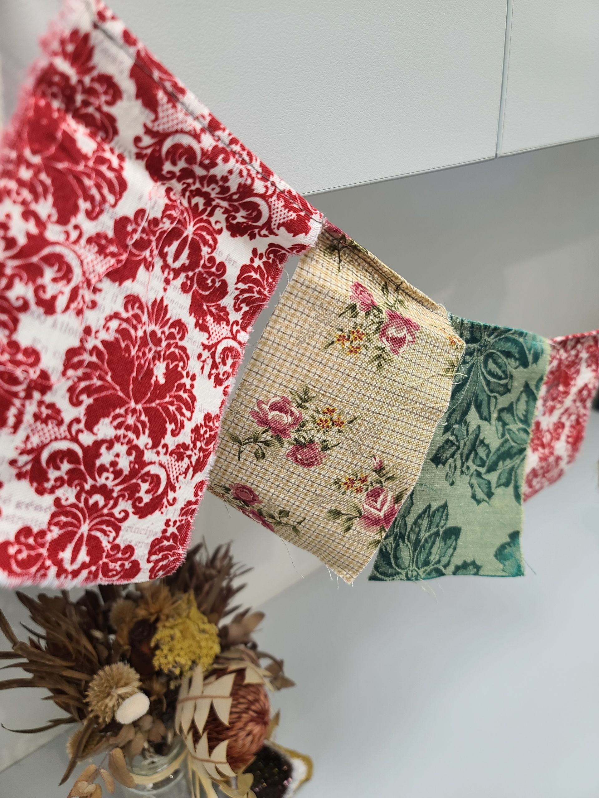 some fabric rectangle shapes spread out on a table to create flags