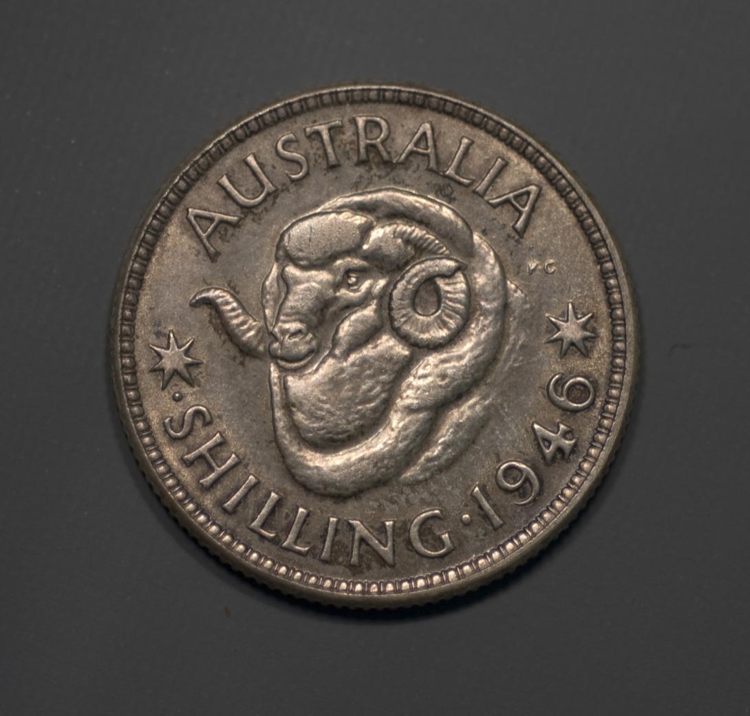 Silver coin 'AUSTRALIA SHILLING 1946' with central design of merino ram's head