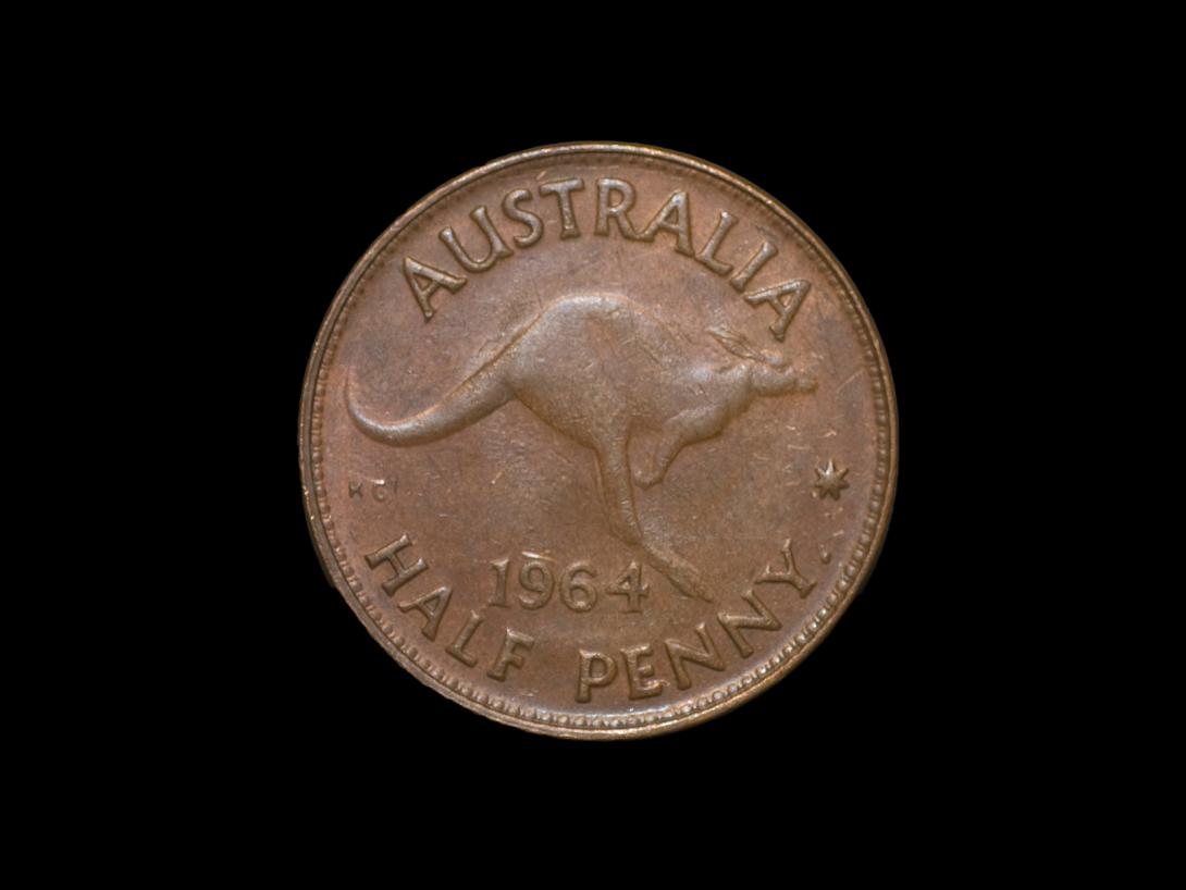 Copper 1964 Australian half penny coin with a central design of a jumping red kangaroo.