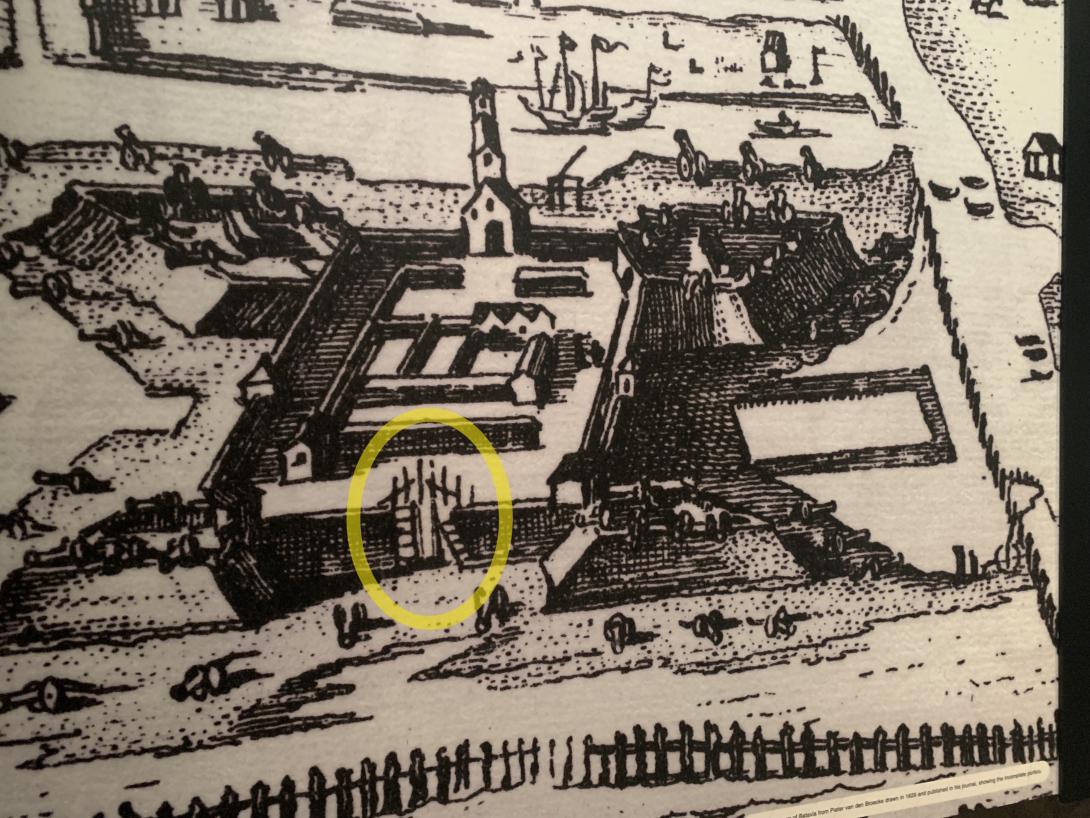 A sketch showing a fort bounded by walls. In the foreground wall, there is a gap with scaffolding.