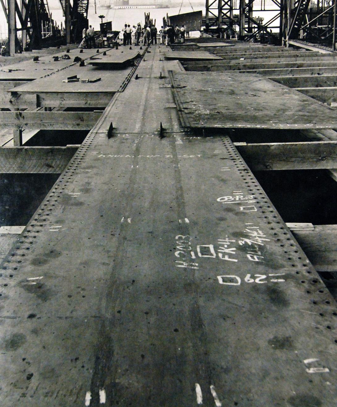 : Keel plates for a Liberty ship laid out before being welded together, 1941.