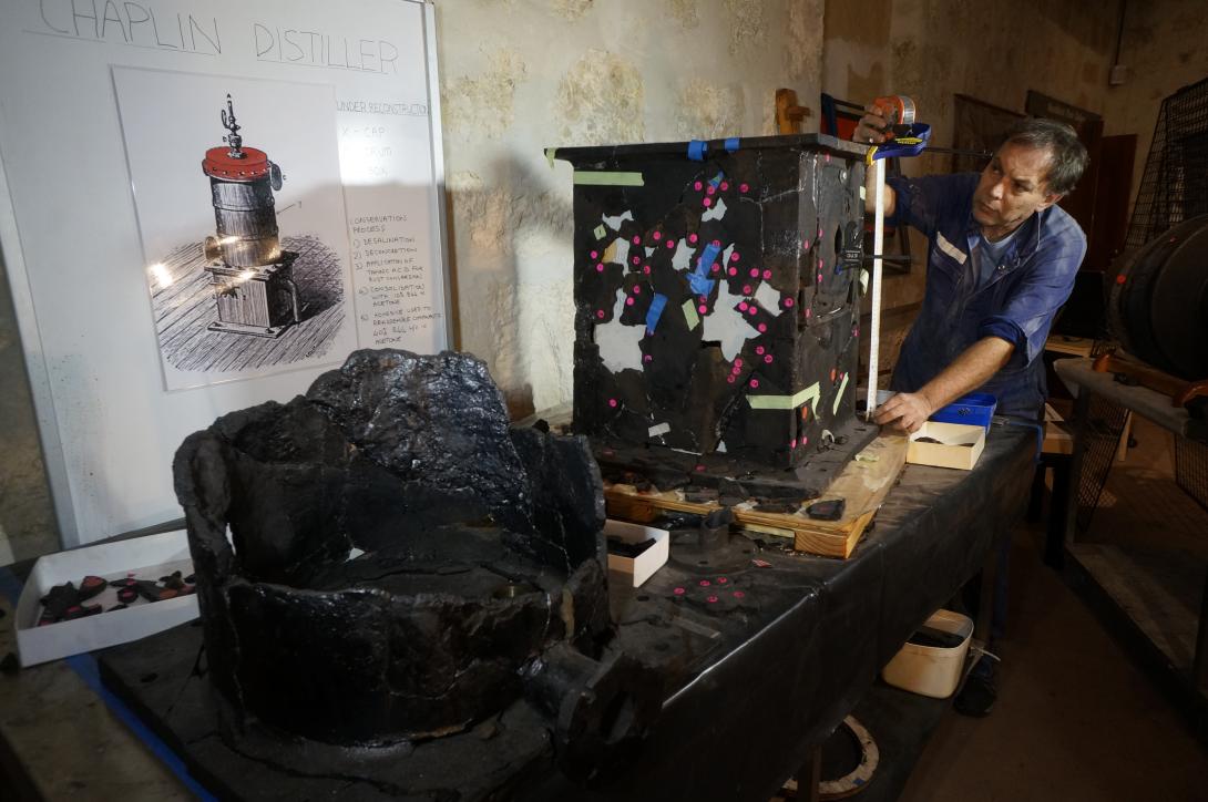 Alex Kilpa reconstructing parts of the distiller in the Xantho gallery, 2014.