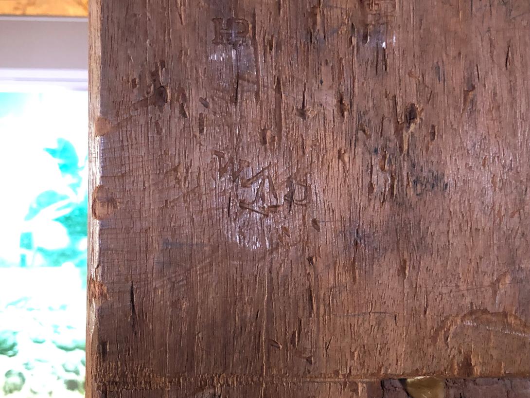 Engraved letters and many markings and carvings.