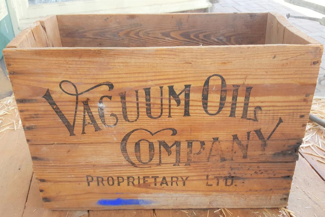 A light coloured wooden box labelled "Vacuum Oil Company Proprietary Limited."