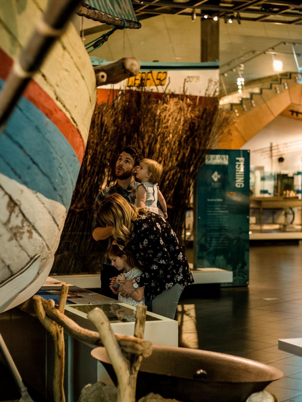 People looking at a boat