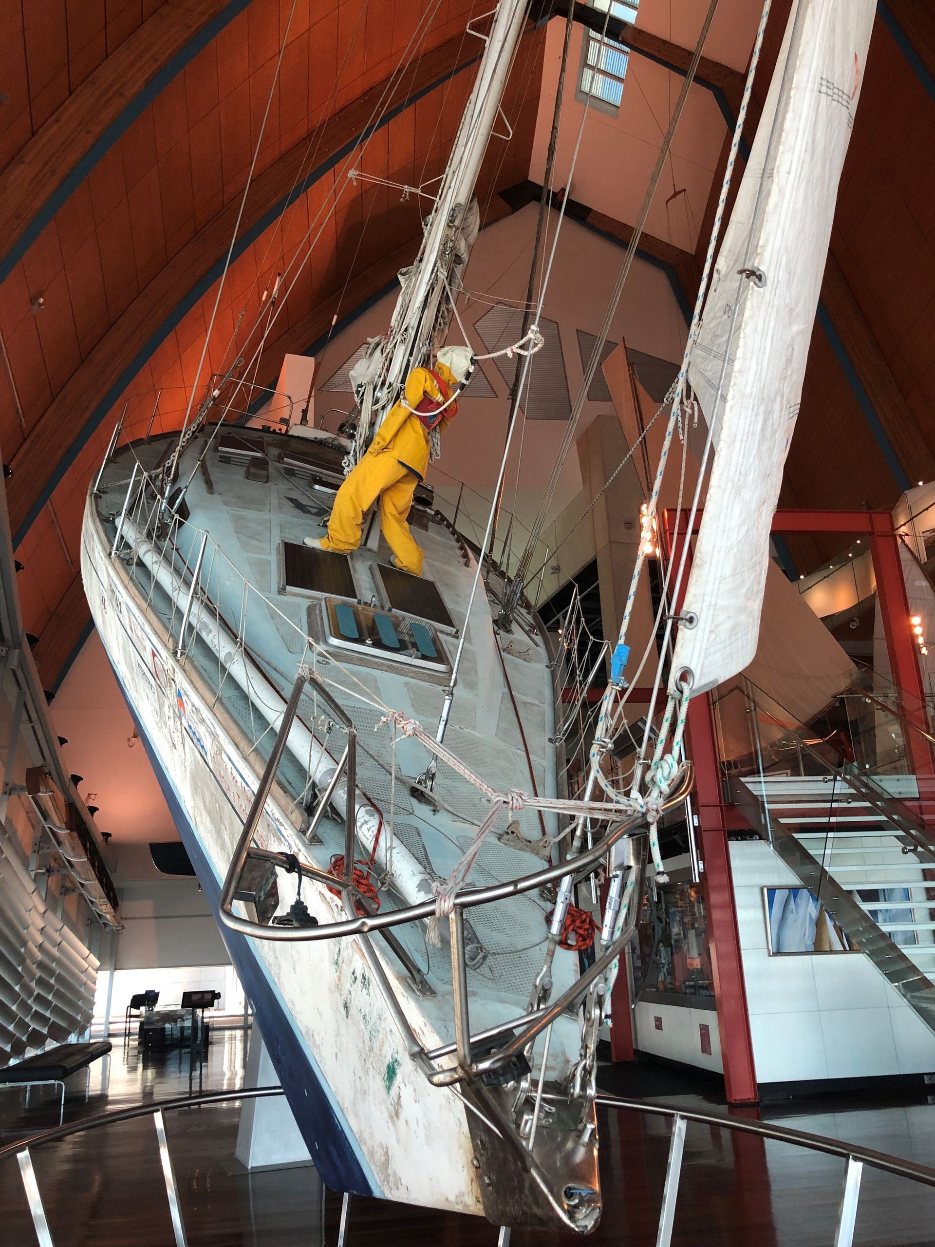 At the far end of the Museum near the water is a large yacht tilted at an extreme angle, a mannequin clinging to the mast.