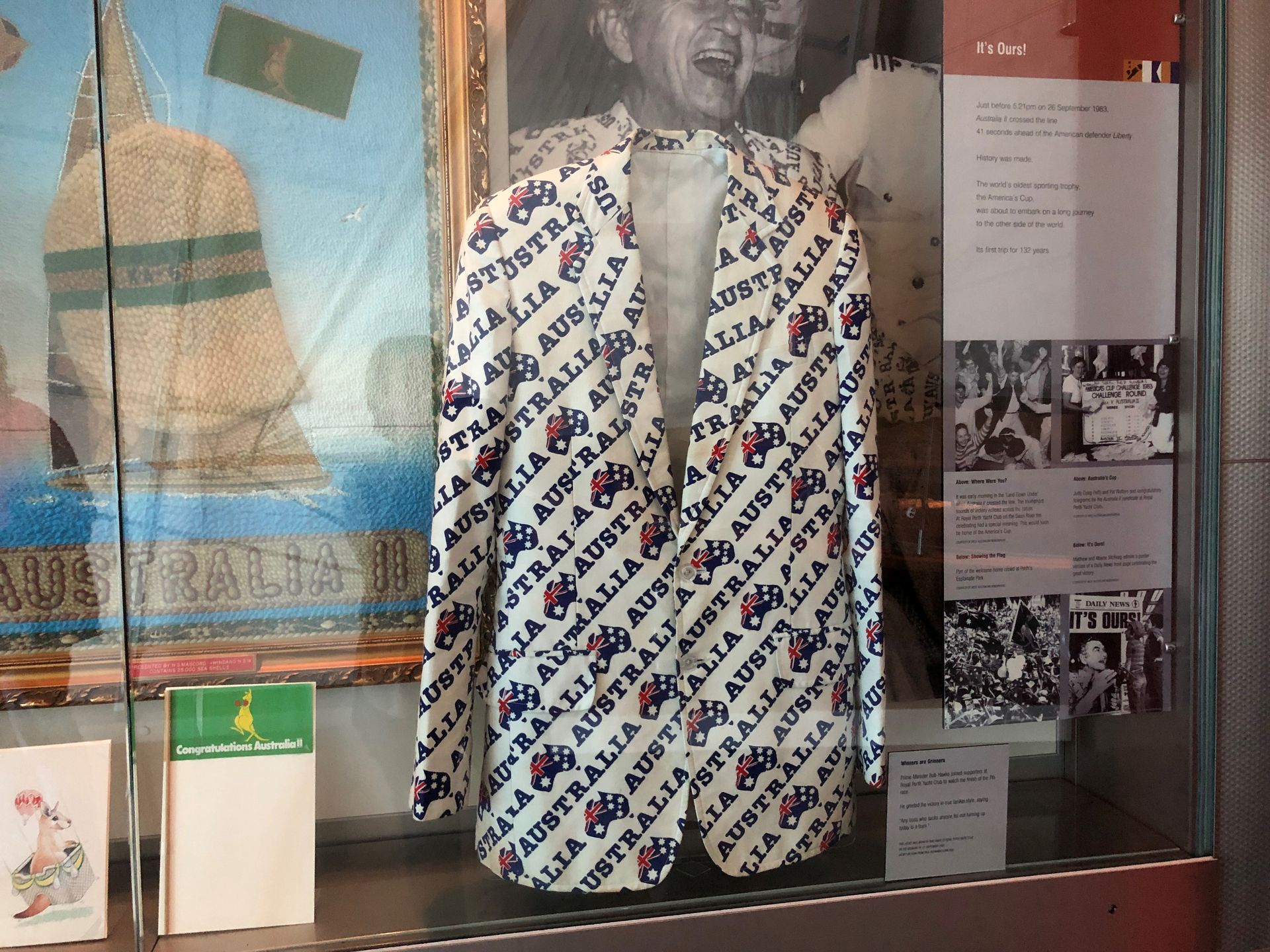 A white men's jacket with "Australia" and Australian iconography repeated over its entire surface.