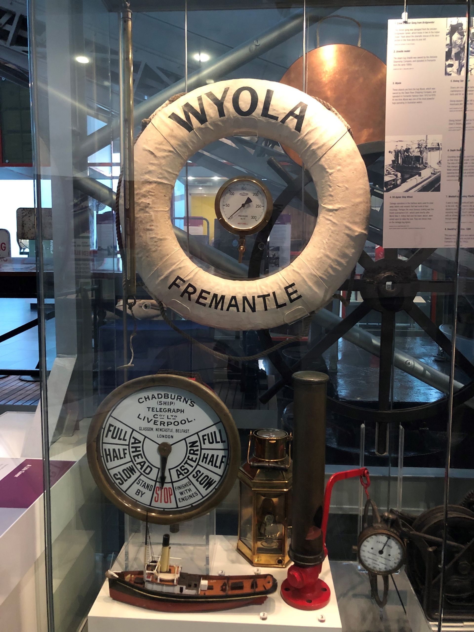 A large round life preserver labelled "Wyola Fremantle," on display behind glass.